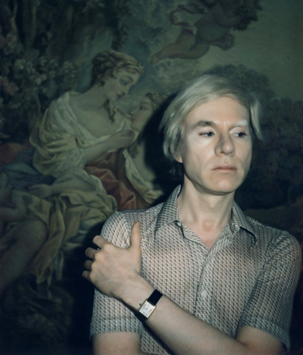 Andy Warhol wearing a Cartier Tank watch